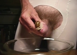 Odd zoophile has a snail pleasuring his boner